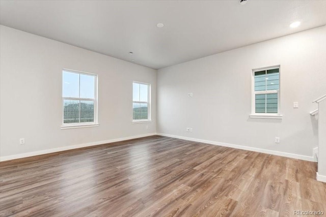 18998 E 94th Pl, Commerce City, CO 80022 - empty room featuring baseboards and wood finished floors