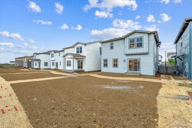 18998 E 94th Pl, Commerce City, CO 80022 - rear view of property with board and batten siding and a residential view