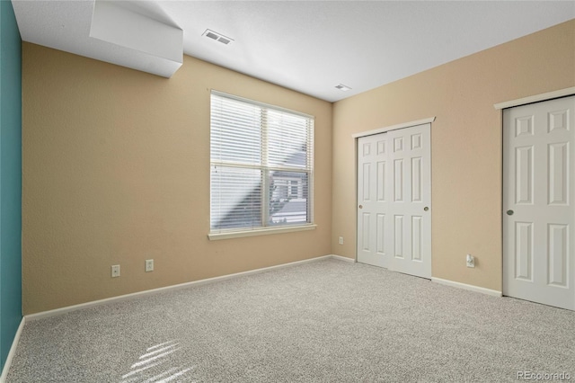 unfurnished bedroom with carpet flooring