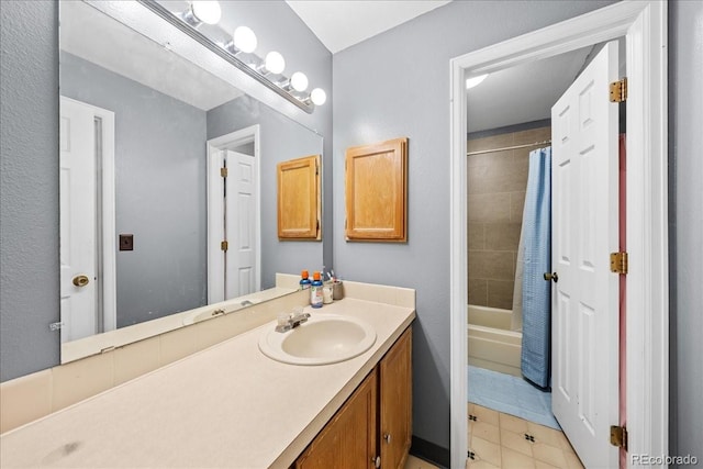 3531 Windmill Dr Unit M5, Fort Collins, CO 80526 - full bath featuring vanity, shower / bath combo with shower curtain, and tile patterned flooring