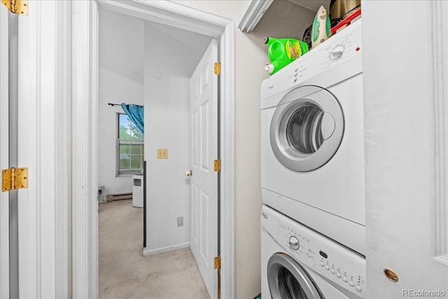 3531 Windmill Dr Unit M5, Fort Collins, CO 80526 - washroom with estacked washer and dryer and light colored carpet