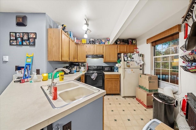 3531 Windmill Dr Unit M5, Fort Collins, CO 80526 - kitchen featuring black appliances, under cabinet range hood, light floors, light countertops, and a peninsula