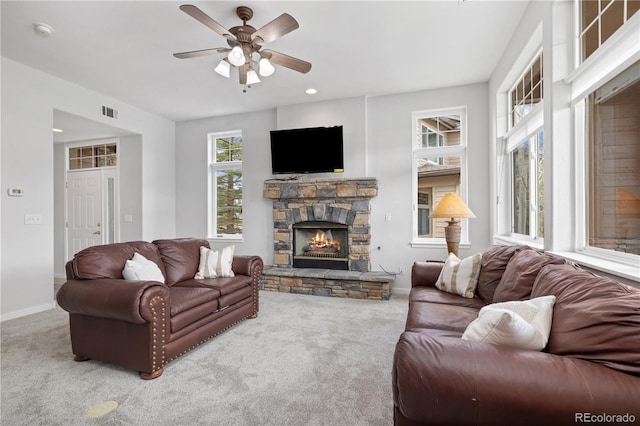 126 Robin Dr Unit 126, Silverthorne, CO 80498 - living room featuring carpet flooring, visible vents, baseboards, and a stone fireplace