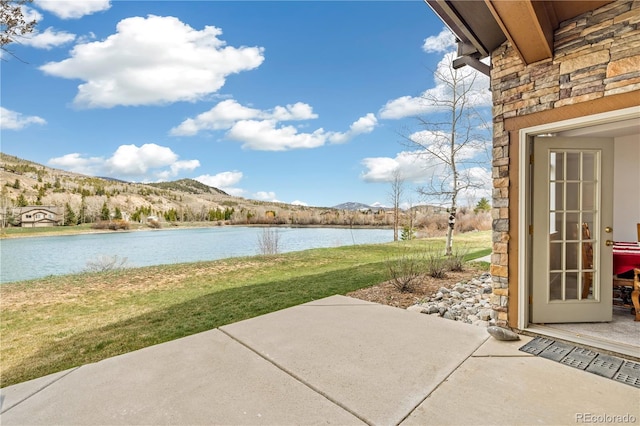 126 Robin Dr Unit 126, Silverthorne, CO 80498 - view of patio with a water and mountain view