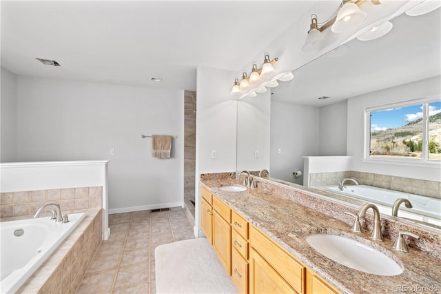 126 Robin Dr Unit 126, Silverthorne, CO 80498 - bathroom with double vanity, a bath, tile patterned flooring, and a sink