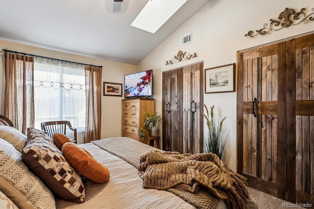 bedroom featuring lofted ceiling with skylight