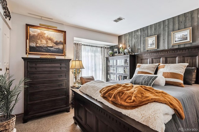 bedroom featuring light carpet