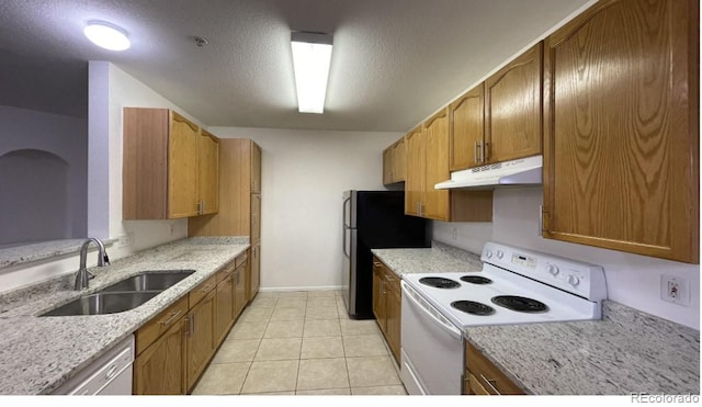 14333 E 1st Dr Unit 108, Aurora, CO 80011 - kitchen with a sink, white appliances, baseboards, under cabinet range hood, and light stone countertops