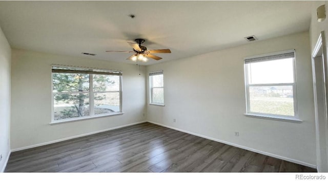 14333 E 1st Dr Unit 108, Aurora, CO 80011 - spare room with wood finished floors, visible vents, a ceiling fan, and baseboards