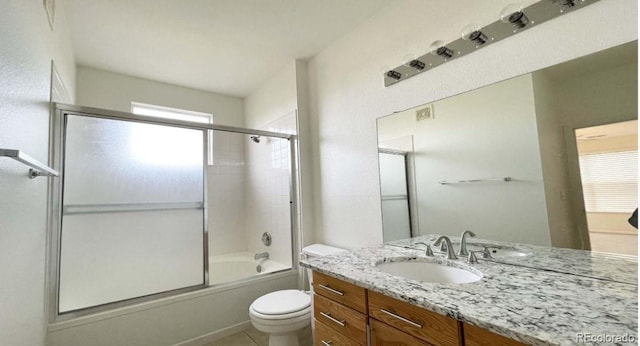 14333 E 1st Dr Unit 108, Aurora, CO 80011 - bathroom with tile patterned flooring, visible vents, toilet, vanity, and bath / shower combo with glass door