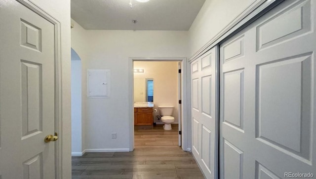 14333 E 1st Dr Unit 108, Aurora, CO 80011 - hall featuring baseboards, wood finished floors, and electric panel