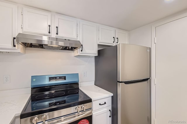 kitchen featuring appliances with stainless steel finishes, under cabinet range hood, white cabinets, and light countertops