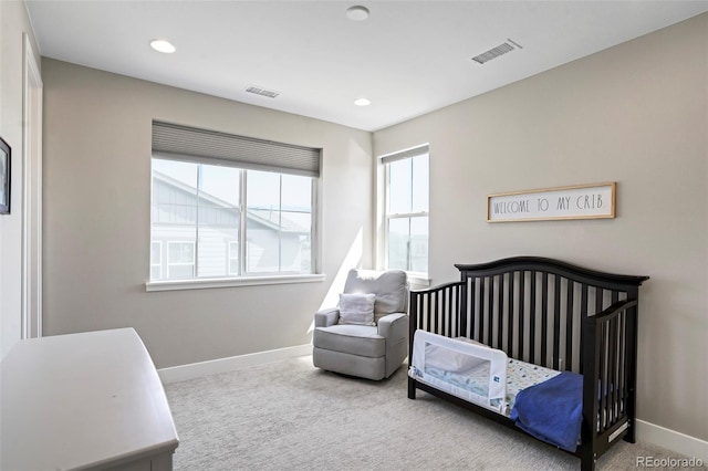 bedroom featuring light colored carpet