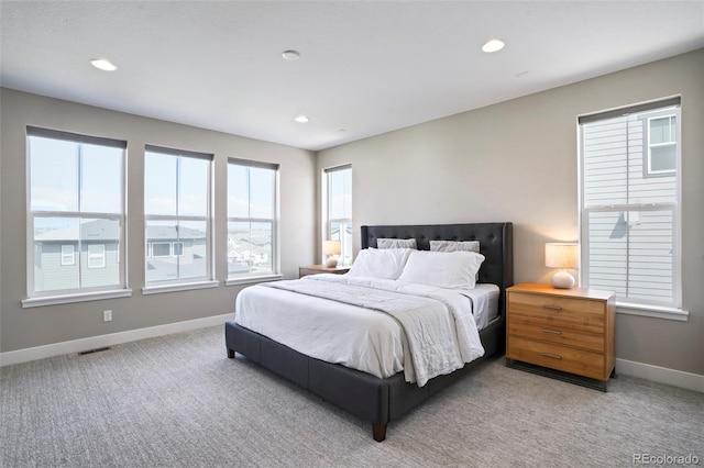 bedroom featuring light colored carpet