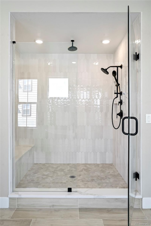 bathroom featuring an enclosed shower