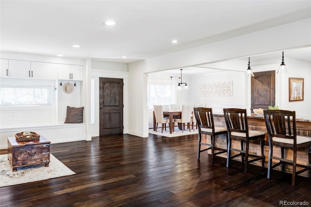 interior space with dark hardwood / wood-style flooring and an inviting chandelier