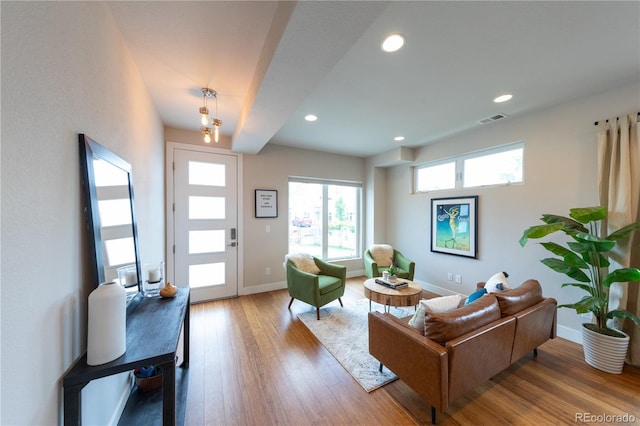 1355 Zenobia St, Denver, CO 80204 - living room featuring baseboards, recessed lighting, and wood finished floors