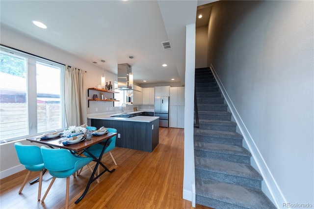 1355 Zenobia St, Denver, CO 80204 - dining space with light wood-type flooring, baseboards, stairs, and recessed lighting
