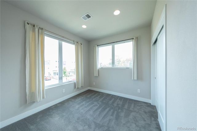 1355 Zenobia St, Denver, CO 80204 - unfurnished bedroom featuring dark carpet, baseboards, and recessed lighting