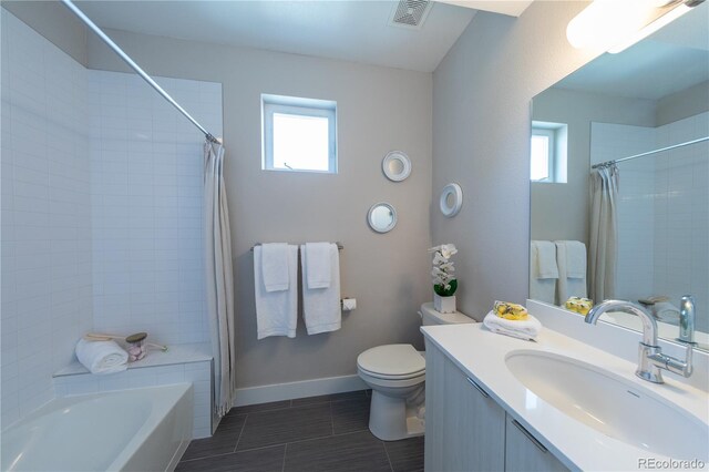 1355 Zenobia St, Denver, CO 80204 - full bathroom featuring vanity, plenty of natural light, toilet, and tile patterned floors