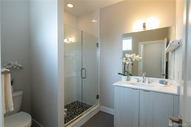1355 Zenobia St, Denver, CO 80204 - full bath featuring a shower stall, vanity, toilet, and baseboards