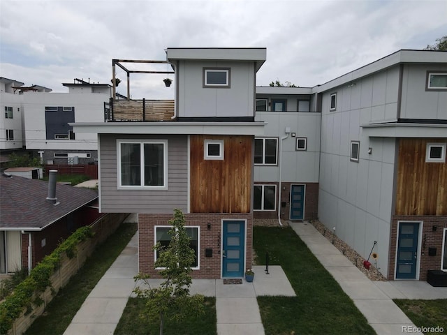 1355 Zenobia St, Denver, CO 80204 - back of property featuring brick siding and a balcony