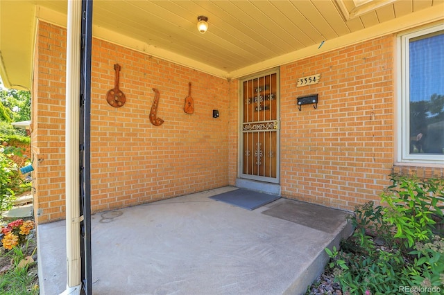 3354 W Arlington Ave, Littleton, CO 80123 - property entrance with brick siding