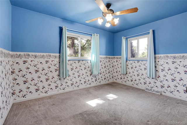 3354 W Arlington Ave, Littleton, CO 80123 - carpeted spare room with a wainscoted wall, plenty of natural light, and a ceiling fan