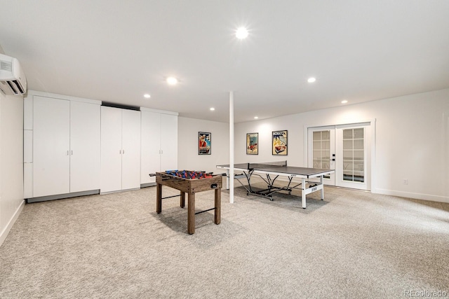 rec room featuring french doors, light colored carpet, and a wall unit AC