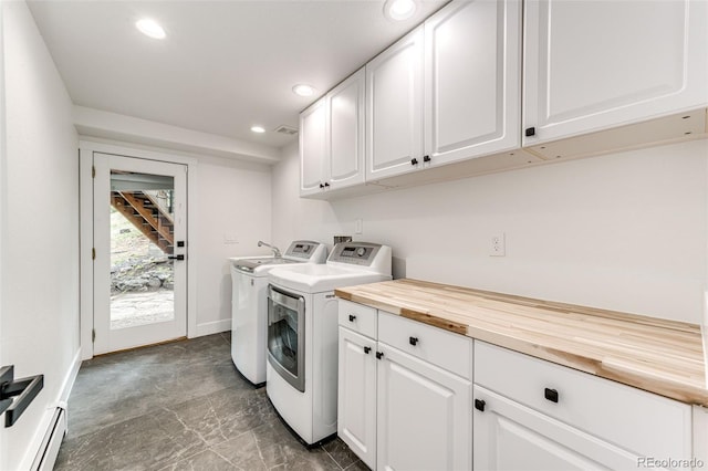 laundry room featuring a baseboard radiator and washing machine and clothes dryer