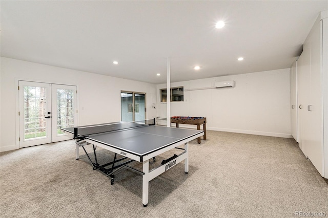 rec room featuring light colored carpet, french doors, and a wall mounted AC