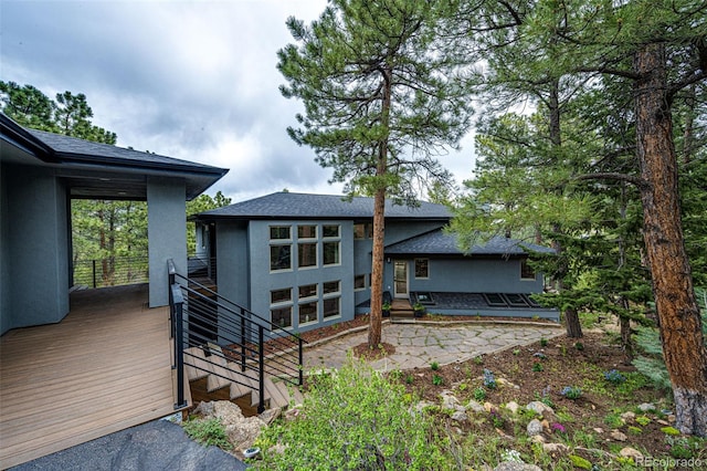 rear view of property featuring a patio