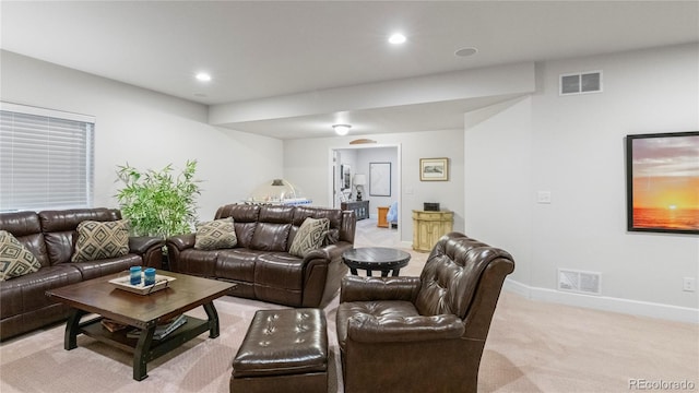 living room with light carpet, visible vents, baseboards, and recessed lighting