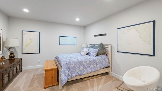 bedroom featuring light colored carpet, baseboards, and recessed lighting