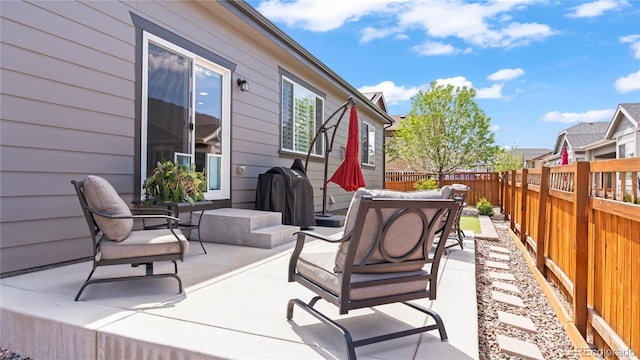 view of patio featuring grilling area and a fenced backyard