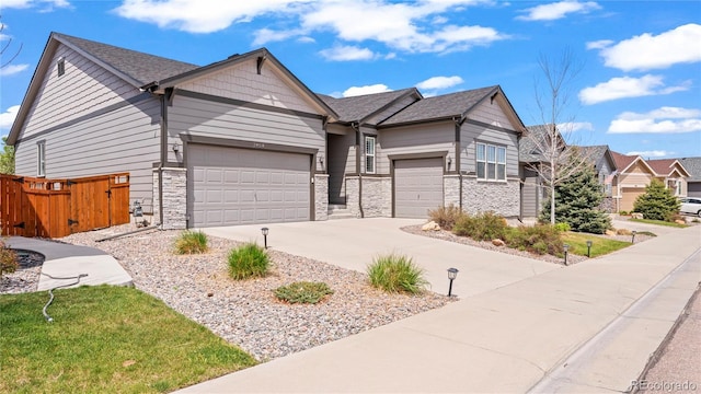 7404 Greenwater Cir, Castle Rock, CO 80108 - single story home featuring a garage, concrete driveway, stone siding, and fence