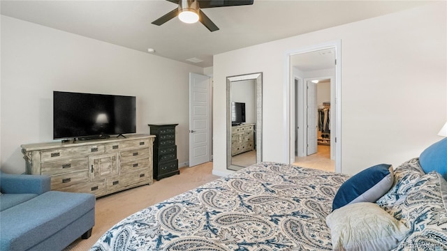 bedroom featuring ceiling fan and light carpet