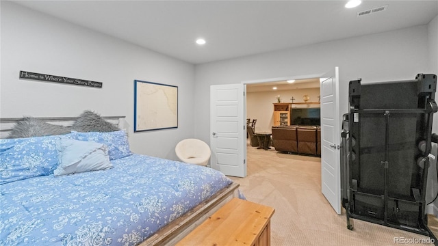 bedroom featuring light colored carpet, visible vents, and recessed lighting