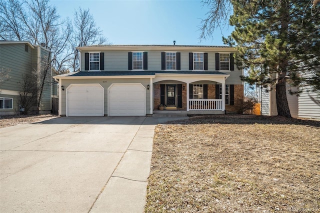 view of front of property featuring concrete driveway, a porch, an attached garage, and brick siding