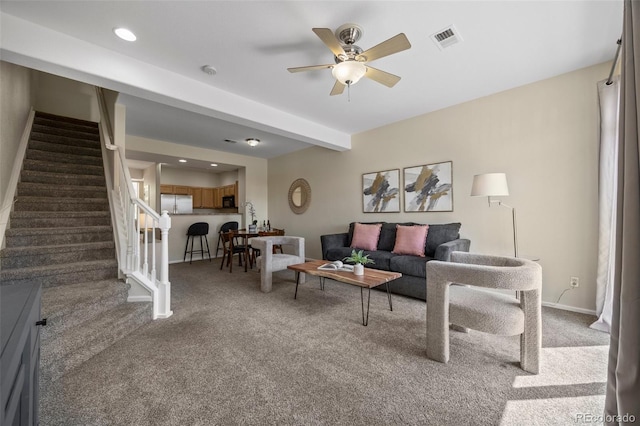 7883 W 55th Ave, Arvada, CO 80002 - living area featuring carpet floors, stairs, and a ceiling fan