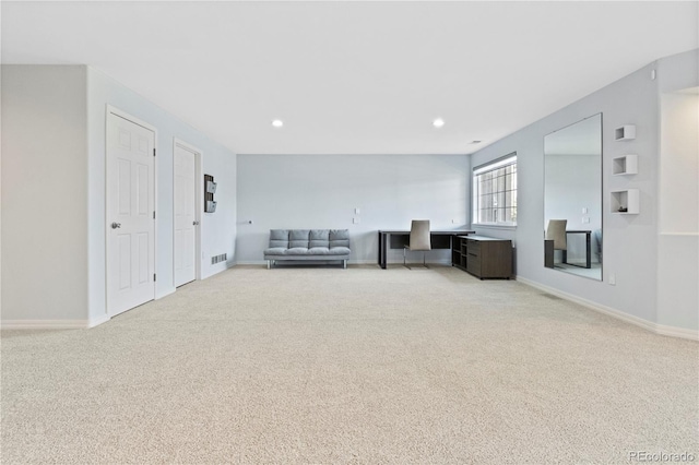 unfurnished room with baseboards, recessed lighting, and carpet