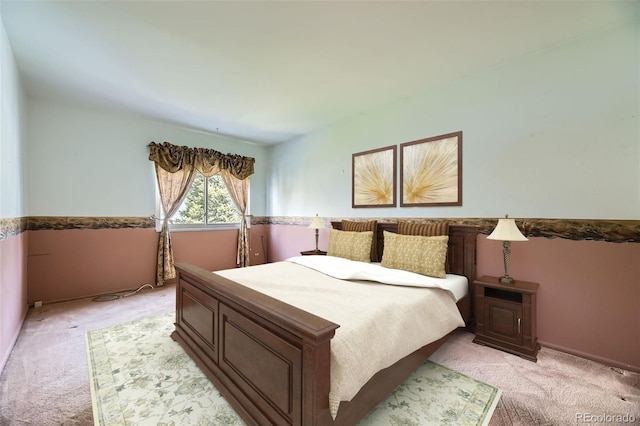bedroom featuring light colored carpet