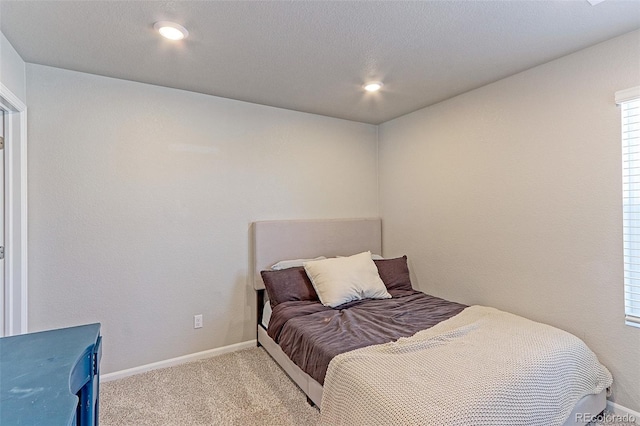 carpeted bedroom with baseboards