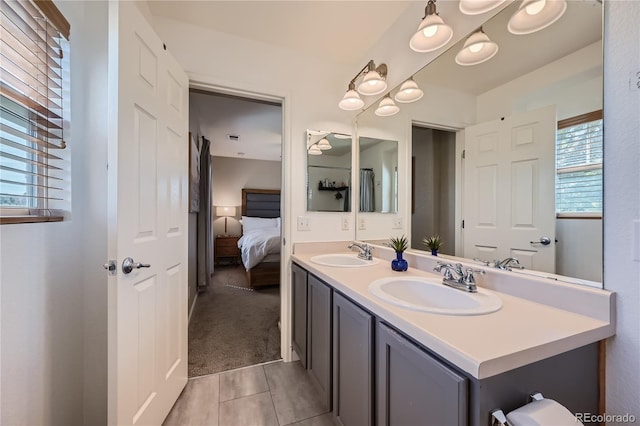 1133 S Richfield St, Aurora, CO 80017 - full bathroom with ensuite bathroom, double vanity, and tile patterned floors