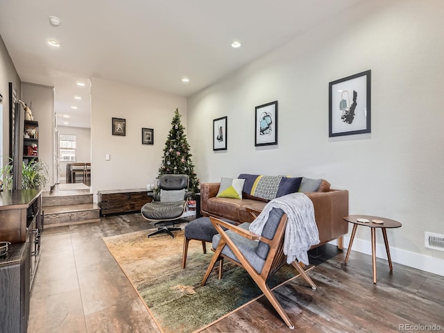 living room with dark hardwood / wood-style flooring