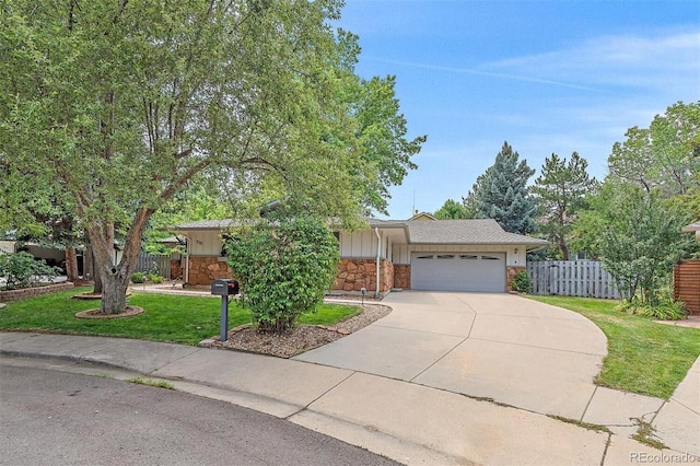 ranch-style home featuring a garage and a front lawn