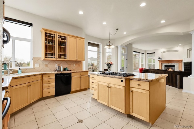 kitchen with dishwasher, light brown cabinets, stainless steel gas cooktop, arched walkways, and recessed lighting