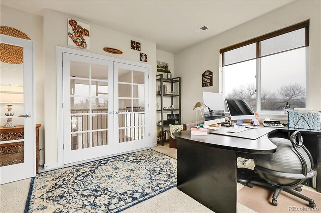 office with french doors and speckle patterned floor