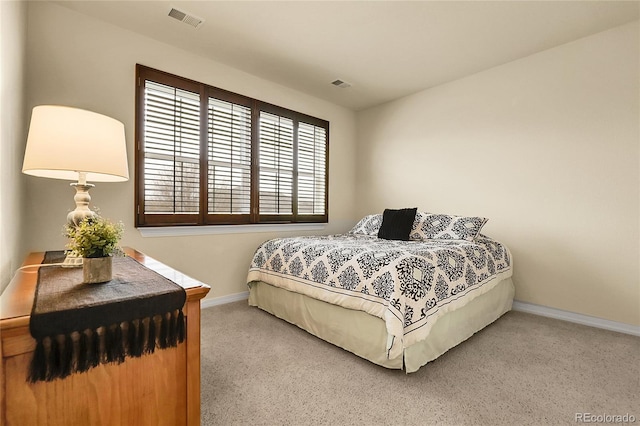bedroom with baseboards and carpet floors