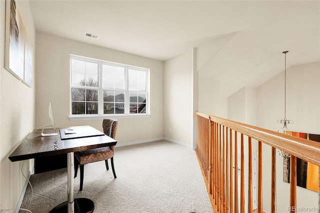 carpeted office space featuring baseboards